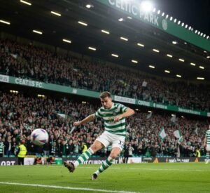 Celtic FC supporters cheering passionately in the stadium during a match